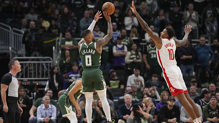 Nov 18, 2024; Milwaukee, Wisconsin, USA; Milwaukee Bucks guard Damian Lillard (0) shoots against Houston Rockets forward Jabari Smith Jr. (10) during the first quarter at Fiserv Forum. Mandatory Credit: Jeff Hanisch-Imagn Images Nov 18, 2024; Milwaukee, Wisconsin, USA; Milwaukee Bucks guard Damian Lillard (0) shoots against Houston Rockets forward Jabari Smith Jr. (10) during the first quarter at Fiserv Forum. Mandatory Credit: Jeff Hanisch-Imagn Images