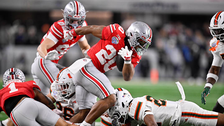 Dec 31, 2025; Arlington, TX, USA; Ohio State Buckeyes running back James Peoples (20) runs with the ball in the third quarter against the Miami Hurricanes during the 2025 Cotton Bowl and quarterfinal game of the College Football Playoff at AT&T Stadium. Mandatory Credit: Jerome Miron-Imagn Images