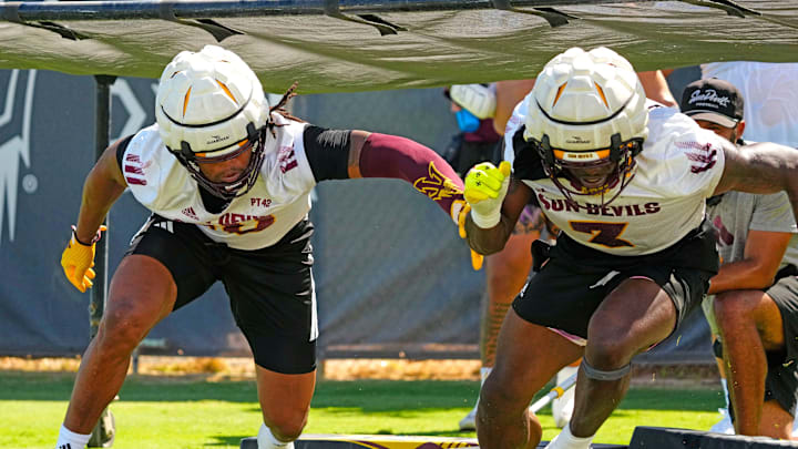 Arizona State defensive linemen Clayton Smith (10) and Albert Smith III (3) run a drill during the first day of fall practice in Tempe, Ariz. on July 30, 2025.