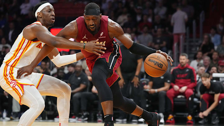 Feb 26, 2025; Miami, Florida, USA;  Miami Heat center Bam Adebayo (13) drives to the basket as Atlanta Hawks forward Onyeka Okongwu (17) defends  in the first half at Kaseya Center. Mandatory Credit: Jim Rassol-Imagn Images