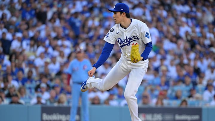 Oct 9, 2025; Los Angeles, California, USA; Los Angeles Dodgers pitcher Roki Sasaki (11) throws in the eighth inning against the Philadelphia Phillies during game four of the NLDS round for the 2025 MLB playoffs at Dodger Stadium. Mandatory Credit: Jayne Kamin-Oncea-Imagn Images