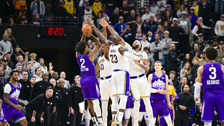 Dec 1, 2024; Salt Lake City, Utah, USA; Utah Jazz guard Collin Sexton (2) gets blocked by Los Angeles Lakers forward LeBron James (23), forward/center Anthony Davis (3), and center Christian Koloko (10) in the final second of the second half at the Delta Center. Mandatory Credit: Christopher Creveling-Imagn Images