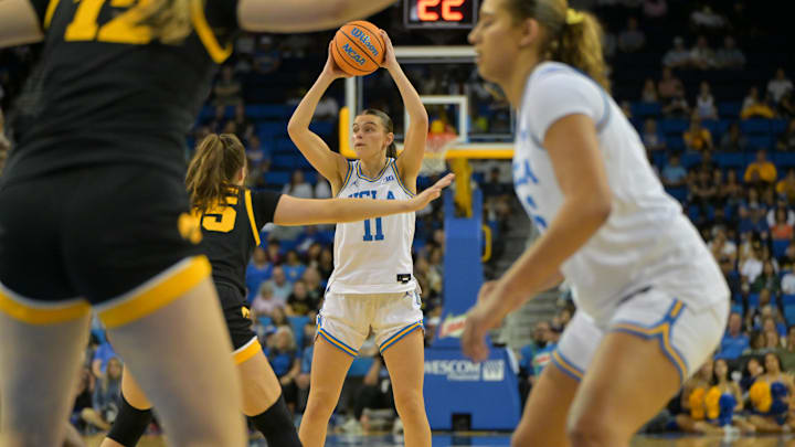 Feb 1, 2026; Los Angeles, California, USA;  UCLA Bruins guard Gabriela Jaquez (11) is defended by Iowa Hawkeyes forward Hannah Stuelke (45) as she looks to make a pass in the first half at Pauley Pavilion presented by Wescom Financial. Mandatory Credit: Jayne Kamin-Oncea-Imagn Images
