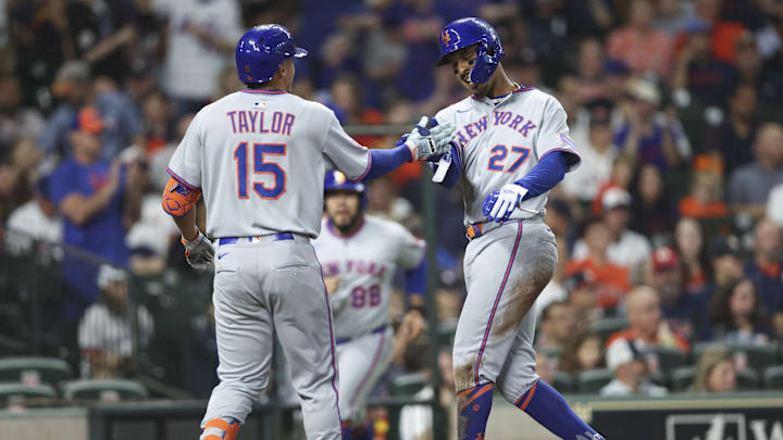 Mar 28, 2025; Houston, TX, USA; New York Mets third baseman Mark Vientos (27) celebrates with center fielder Tyrone Taylor (15) after scoring a run during the second inning against the Houston Astros at Daikin Park. Mandatory Credit: Troy Taormina-Imagn Images