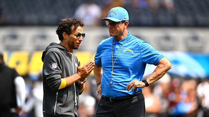 Los Angeles Chargers head coach Jim Harbaugh stands on the field with offensive coordinator Mike McDaniel Los Angeles Chargers head coach Jim Harbaugh stands on the field with offensive coordinator Mike McDaniel