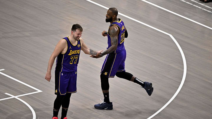 Apr 9, 2025; Dallas, Texas, USA; Los Angeles Lakers guard Luka Doncic (77) and Lakers forward LeBron James (23) celebrate during the fourth quarter against the Dallas Mavericks at the American Airlines Center. Mandatory Credit: Jerome Miron-Imagn Images Apr 9, 2025; Dallas, Texas, USA; Los Angeles Lakers guard Luka Doncic (77) and Lakers forward LeBron James (23) celebrate during the fourth quarter against the Dallas Mavericks at the American Airlines Center. Mandatory Credit: Jerome Miron-Imagn Images