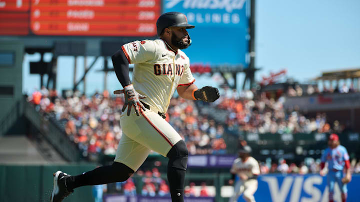 Sep 28, 2024; San Francisco, California, USA; San Francisco Giants outfielder Heliot Ramos (17) runs toward home to score a run on a fielding error by St. Louis Cardinals infielder Masyn Winn (0) (not pictured) during the first inning at Oracle Park. 
