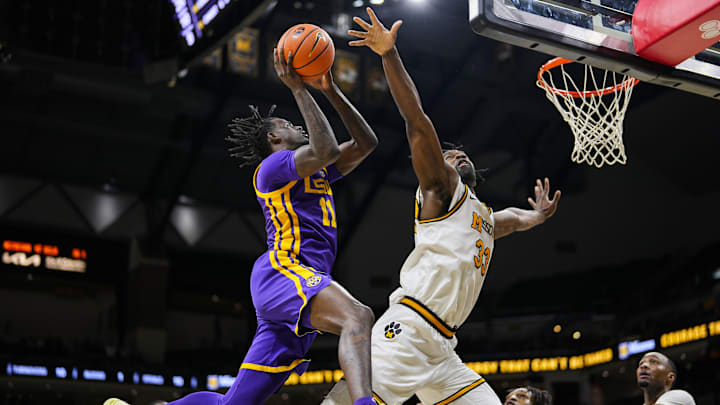 Jan 7, 2025; Columbia, Missouri, USA; LSU Tigers forward Corey Chest (11) shoots against Missouri Tigers center Josh Gray (33) during the second half at Mizzou Arena. Mandatory Credit: Jay Biggerstaff-Imagn Images Jan 7, 2025; Columbia, Missouri, USA; LSU Tigers forward Corey Chest (11) shoots against Missouri Tigers center Josh Gray (33) during the second half at Mizzou Arena. Mandatory Credit: Jay Biggerstaff-Imagn Images
