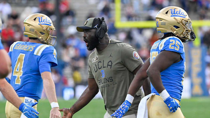Nov 30, 2024; Pasadena, California, USA; UCLA Bruins head coach DeShaun Foster greets quarterback Ethan Garbers (4) during the third quarter against the Fresno State Bulldogs at Rose Bowl. Mandatory Credit: Robert Hanashiro-Imagn Images