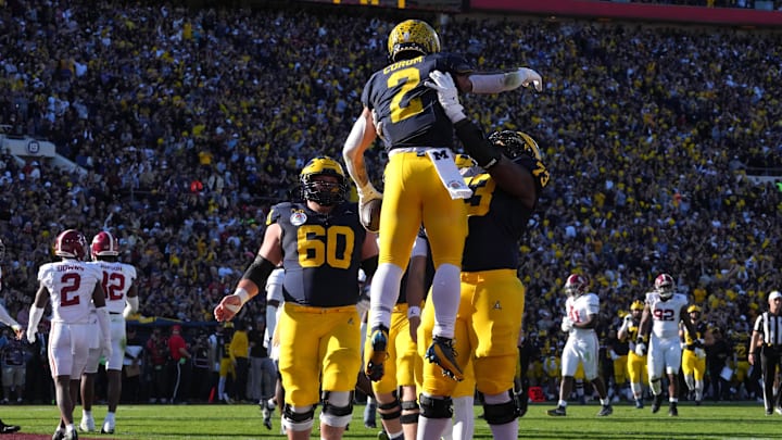 Jan 1, 2024; Pasadena, CA, USA; Michigan Wolverines running back Blake Corum (2) is congratulated by