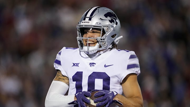 Nov 18, 2023; Lawrence, Kansas, USA; Kansas State Wildcats wide receiver Keagan Johnson (10) scores a touchdown during the first half against the Kansas State Wildcats at David Booth Kansas Memorial Stadium. Mandatory Credit: Jay Biggerstaff-Imagn Images Nov 18, 2023; Lawrence, Kansas, USA; Kansas State Wildcats wide receiver Keagan Johnson (10) scores a touchdown during the first half against the Kansas State Wildcats at David Booth Kansas Memorial Stadium. Mandatory Credit: Jay Biggerstaff-Imagn Images
