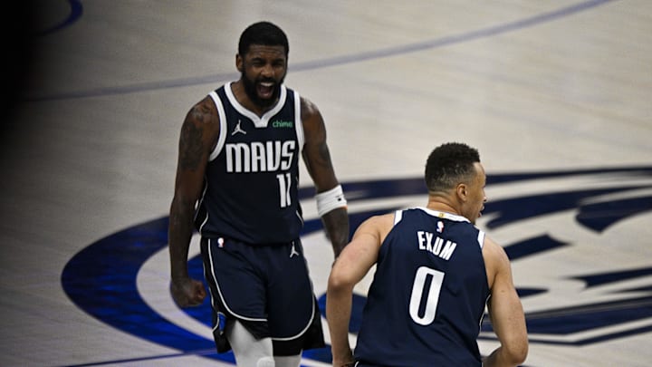 May 28, 2024; Dallas, Texas, USA; Dallas Mavericks guard Kyrie Irving (11) and guard Dante Exum (0) celebrate scoring against the Minnesota Timberwolves during the second quarter in game four of the Western Conference finals for the 2024 NBA playoffs at American Airlines Center. Mandatory Credit: Jerome Miron-USA TODAY Sports