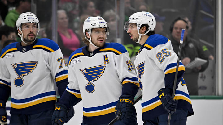 Dec 14, 2024; Dallas, Texas, USA; St. Louis Blues defenseman Justin Faulk (72) and center Robert Thomas (18) and center Jordan Kyrou (25) in action during the game between the Dallas Stars and the St. Louis Blues at American Airlines Center. Mandatory Credit: Jerome Miron-Imagn Images