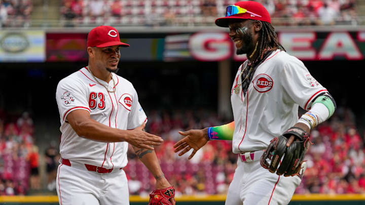 Cincinnati Reds pitcher Fernando Cruz (63) high fives with shortstop Elly De La Cruz (44) after playing a bunt for the final out of the top of the fourth inning of the MLB National League Game between the Cincinnati Reds and the Pittsburgh Pirates at Great American Ball Park in downtown Cincinnati on Sunday, Sept. 22, 2024. The Pirates led 1-0 after four innings. Cincinnati Reds pitcher Fernando Cruz (63) high fives with shortstop Elly De La Cruz (44) after playing a bunt for the final out of the top of the fourth inning of the MLB National League Game between the Cincinnati Reds and the Pittsburgh Pirates at Great American Ball Park in downtown Cincinnati on Sunday, Sept. 22, 2024. The Pirates led 1-0 after four innings.