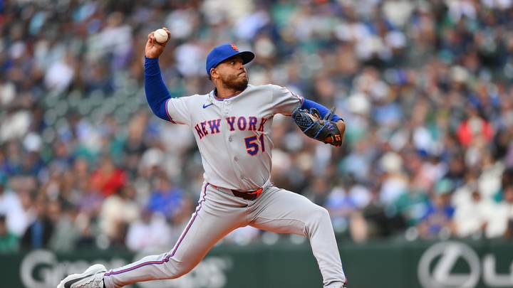Jun 3, 2026; Seattle, Washington, USA; New York Mets starting pitcher Freddy Peralta (51) pitches to the Seattle Mariners during the first inning at T-Mobile Park. Mandatory Credit: Steven Bisig-Imagn Images