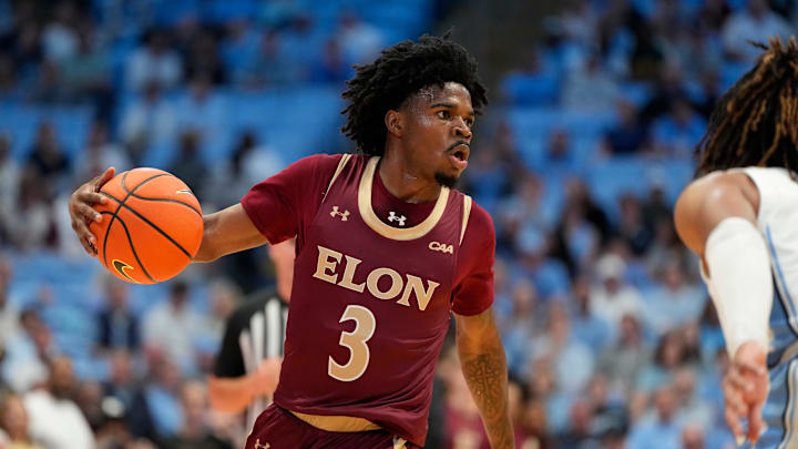 Nov 4, 2024; Chapel Hill, North Carolina, USA; Elon Phoenix guard TK Simpkins (3) dribbles in the first half at Dean E. Smith Center. Mandatory Credit: Bob Donnan-Imagn Images