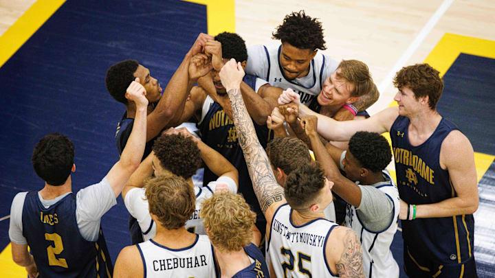 Notre Dame men's basketball players huddle up before a drill during an open practice at Rolfs Athletics Hall on Thursday, July 18, 2024, in South Bend. Notre Dame men's basketball players huddle up before a drill during an open practice at Rolfs Athletics Hall on Thursday, July 18, 2024, in South Bend.