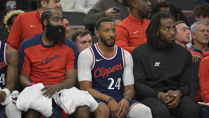 Oct 30, 2024; Inglewood, California, USA;  Los Angeles Clippers guard James Harden (1), guard Norman Powell (24) and forward Kawhi Leonard (2) looks on from the bench in the first half against the Portland Trail Blazers at Intuit Dome. Mandatory Credit: Jayne Kamin-Oncea-Imagn Images