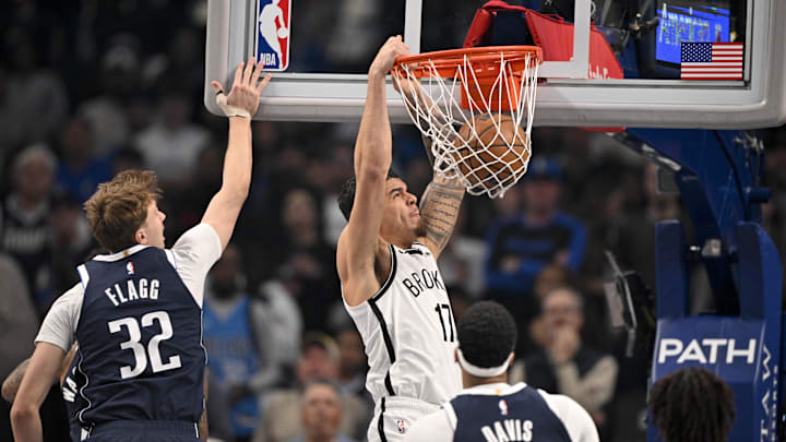 Dec 12, 2025; Dallas, Texas, USA; Brooklyn Nets forward Michael Porter Jr. (17) dunks the ball past Dallas Mavericks forward Cooper Flagg (32) and forward Anthony Davis (3) during the first quarter at the American Airlines Center. Mandatory Credit: Jerome Miron-Imagn Images Dec 12, 2025; Dallas, Texas, USA; Brooklyn Nets forward Michael Porter Jr. (17) dunks the ball past Dallas Mavericks forward Cooper Flagg (32) and forward Anthony Davis (3) during the first quarter at the American Airlines Center. Mandatory Credit: Jerome Miron-Imagn Images