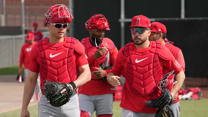 Feb 16, 2025; Tempe, AZ, USA; Los Angeles Angels catcher Logan O'Hoppe (14) leads the catchers to the bullpen during spring training camp. Mandatory Credit: Rick Scuteri-Imagn Images