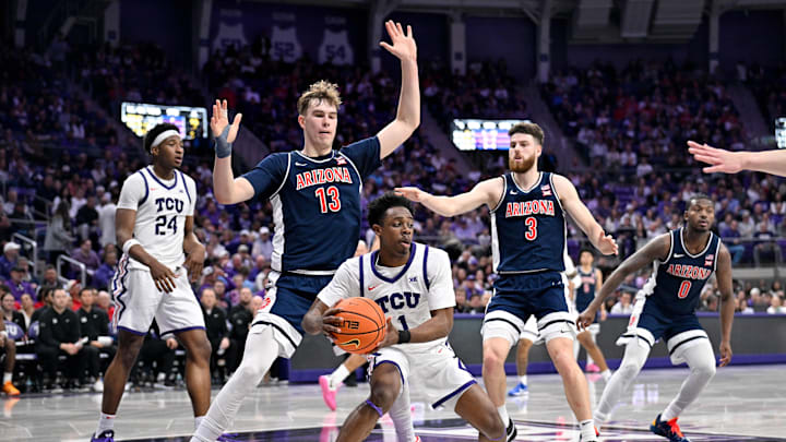 Jan 10, 2026; Fort Worth, Texas, USA; TCU Horned Frogs guard Jayden Pierre (1) looks to move the ball past Arizona Wildcats center Motiejus Krivas (13) and guard Anthony Dell'orso (3) during the first half at the Ed and Rae Schollmaier Arena. Mandatory Credit: Jerome Miron-Imagn Images