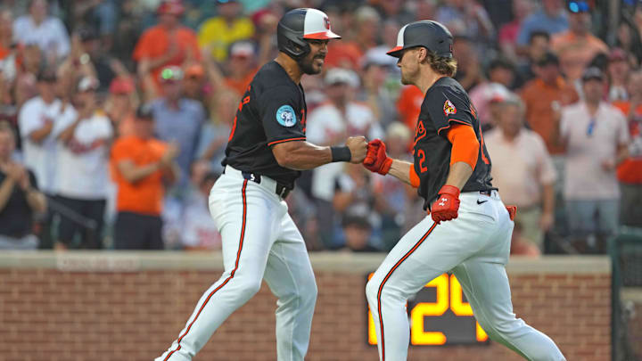 Aug 15, 2024; Baltimore, Maryland, USA; Baltimore Orioles  shortstop Gunnar Henderson (right) greeted by outfielder Anthony Santander (left) following his two run home run in the fourth inning against the Boston Red Sox at Oriole Park at Camden Yards.