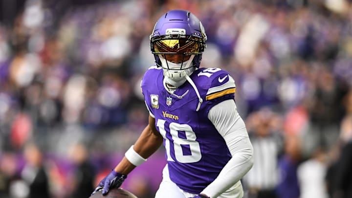 Minnesota Vikings wide receiver Justin Jefferson (18) warms up before the game against the Baltimore Ravens at U.S. Bank Stadium. 