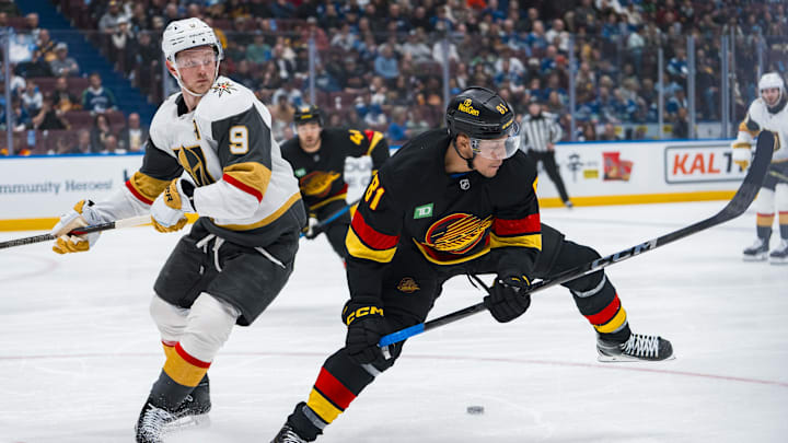 Apr 6, 2025; Vancouver, British Columbia, CAN; Vegas Golden Knights forward Jack Eichel (9) checks Vancouver Canucks forward Dakota Joshua (81) in the second period at Rogers Arena. Mandatory Credit: Bob Frid-Imagn Images