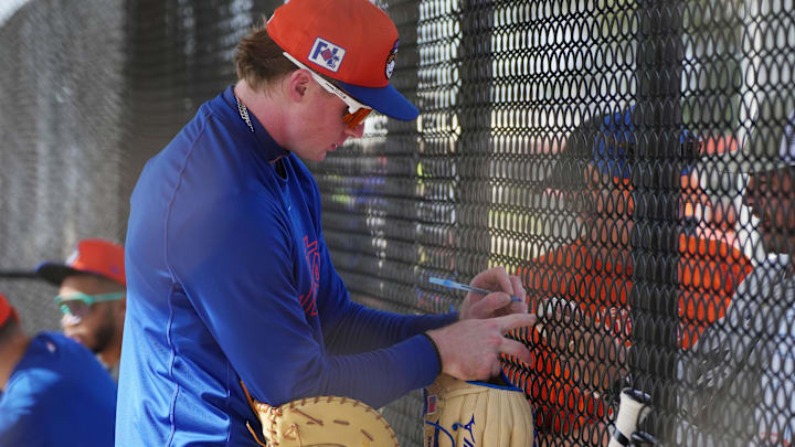 Feb 13, 2025; Port St. Lucie, FL, USA; New York Mets infielder Ryan Clifford (97)signs autographs during Spring Training. Mandatory Credit: Jim Rassol-Imagn Images