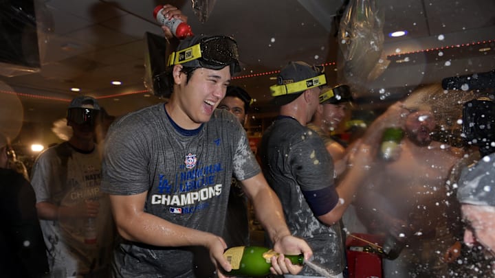 Oct 20, 2024; Los Angeles, California, USA; Los Angeles Dodgers designated hitter Shohei Ohtani (17) celebrates with champagne in the clubhouse after defeating the New York Mets in game six of the NLCS for the 2024 MLB playoffs at Dodger Stadium. Mandatory Credit: Jayne Kamin-Oncea-Imagn Images Oct 20, 2024; Los Angeles, California, USA; Los Angeles Dodgers designated hitter Shohei Ohtani (17) celebrates with champagne in the clubhouse after defeating the New York Mets in game six of the NLCS for the 2024 MLB playoffs at Dodger Stadium. Mandatory Credit: Jayne Kamin-Oncea-Imagn Images