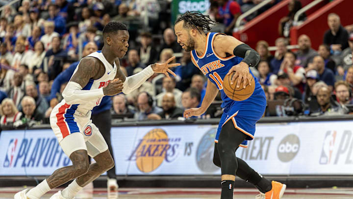Apr 27, 2025; Detroit, Michigan, USA; New York Knicks guard Jalen Brunson (11) moves the ball up court as Detroit Pistons guard Dennis Schroder (17) defends during the third quarter of game four of first round for the 2025 NBA Playoffs at Little Caesars Arena. Mandatory Credit: David Reginek-Imagn Images