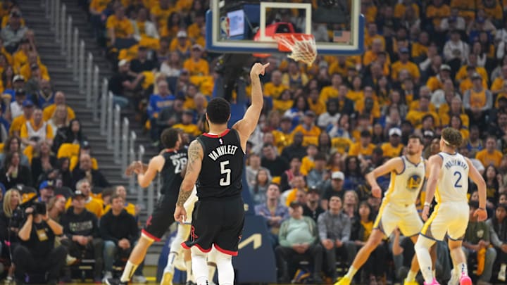 Apr 26, 2025; San Francisco, California, USA; Houston Rockets guard Fred VanVleet (5) scores against the Golden State Warriors during the first quarter of game three of first round for the 2024 NBA Playoffs at Chase Center. Mandatory Credit: Darren Yamashita-Imagn Images