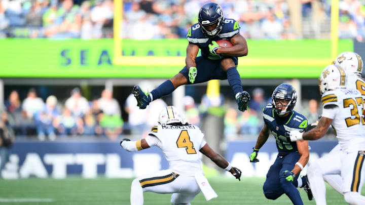 Seattle Seahawks running back Kenneth Walker III hurdles over New Orleans Saints cornerback Kool-Aid McKinstry