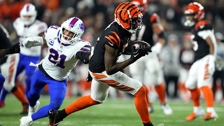 Cincinnati Bengals wide receiver Tee Higgins (5) completes a catch over Buffalo Bills safety Jordan Poyer (21) at Paycor Stadium in Cincinnati.