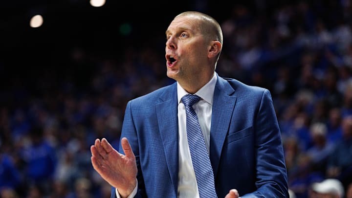 Nov 21, 2025; Lexington, Kentucky, USA; Kentucky Wildcats head coach Mark Pope talks with his players on the court during the first half against the Loyola (MD) Greyhounds at Rupp Arena at Central Bank Center. Mandatory Credit: Jordan Prather-Imagn Images Nov 21, 2025; Lexington, Kentucky, USA; Kentucky Wildcats head coach Mark Pope talks with his players on the court during the first half against the Loyola (MD) Greyhounds at Rupp Arena at Central Bank Center. Mandatory Credit: Jordan Prather-Imagn Images