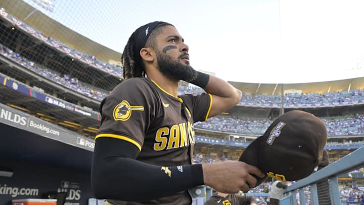 Oct 11, 2024; Los Angeles, California, USA; San Diego Padres outfielder Fernando Tatis Jr. (23) looks on from the dugout before game five against the Los Angeles Dodgers in the NLDS for the 2024 MLB Playoffs at Dodger Stadium. Mandatory Credit: Jayne Kamin-Oncea-Imagn Images