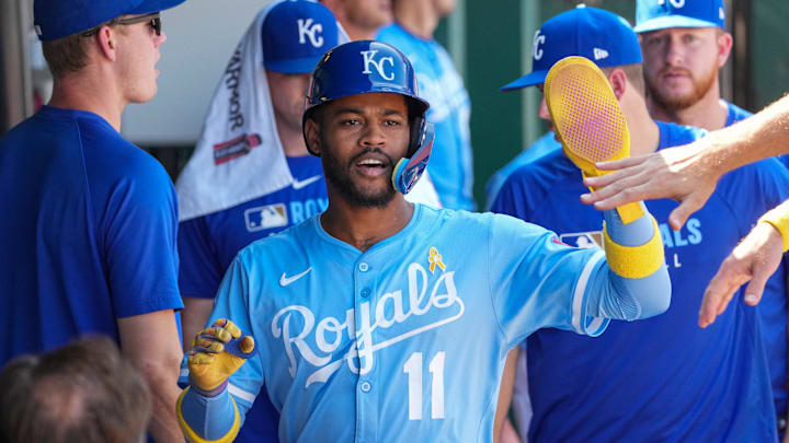 Sep 7, 2025; Kansas City, Missouri, USA; Kansas City Royals shortstop Maikel Garcia (11) celebrates in the dugout after scoring against the Minnesota Twins in the sixth inning at Kauffman Stadium. Mandatory Credit: Denny Medley-Imagn Images