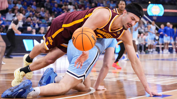 Minnesota Golden Gophers forward Dawson Garcia (3) loses control of the ball against Indiana State Sycamores center Robbie Avila (21) on Sunday, March 24, 2024, during the second round of the NIT at the Hulman Center in Terre Haute. The Indiana State Sycamores defeated the Minnesota Golden Gophers, 76-64. Minnesota Golden Gophers forward Dawson Garcia (3) loses control of the ball against Indiana State Sycamores center Robbie Avila (21) on Sunday, March 24, 2024, during the second round of the NIT at the Hulman Center in Terre Haute. The Indiana State Sycamores defeated the Minnesota Golden Gophers, 76-64.