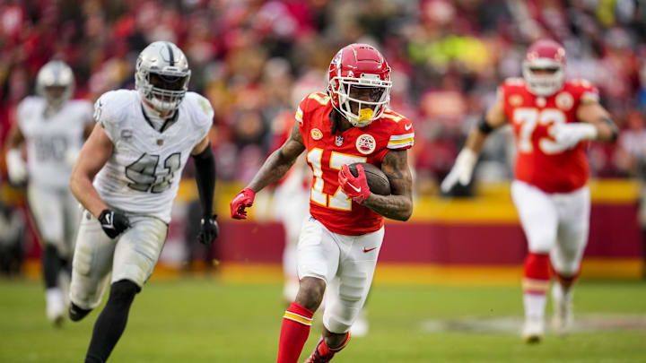 Dec 25, 2023; Kansas City, Missouri, USA; Kansas City Chiefs wide receiver Richie James (17) runs with the ball past Las Vegas Raiders linebacker Robert Spillane (41) during the second half at GEHA Field at Arrowhead Stadium. Mandatory Credit: Jay Biggerstaff-Imagn Images Dec 25, 2023; Kansas City, Missouri, USA; Kansas City Chiefs wide receiver Richie James (17) runs with the ball past Las Vegas Raiders linebacker Robert Spillane (41) during the second half at GEHA Field at Arrowhead Stadium. Mandatory Credit: Jay Biggerstaff-Imagn Images