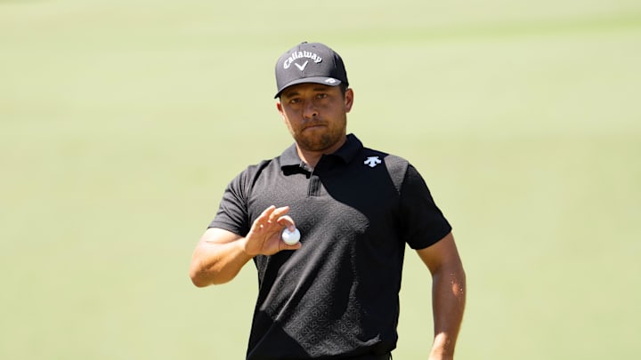 Apr 14, 2024; Augusta, Georgia, USA; Xander Schauffele reacts after putting on No. 2 during the