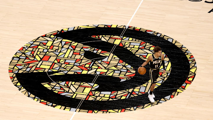 Jan 18, 2021; Atlanta, Georgia, USA; Atlanta Hawks guard Trae Young (11) dribbles up the court over the Atlanta Hawks logo in the second half against the Minnesota Timberwolves at State Farm Arena. Mandatory Credit: Jason Getz-Imagn Images Jan 18, 2021; Atlanta, Georgia, USA; Atlanta Hawks guard Trae Young (11) dribbles up the court over the Atlanta Hawks logo in the second half against the Minnesota Timberwolves at State Farm Arena. Mandatory Credit: Jason Getz-Imagn Images