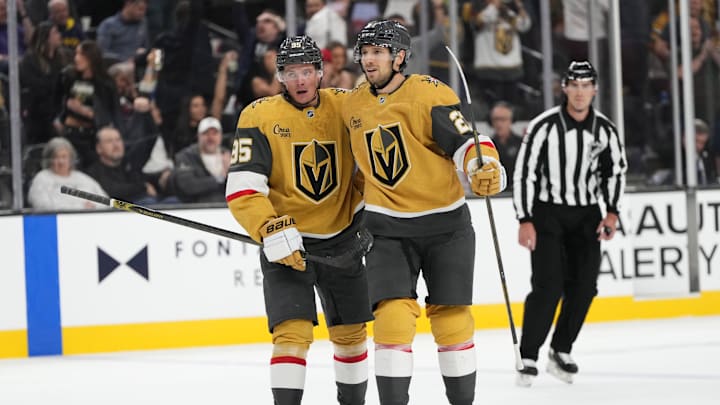Oct 9, 2024; Las Vegas, Nevada, USA; Vegas Golden Knights right wing Victor Olofsson (95) celebrates with defenseman Shea Theodore (27) after scoring a goal against the Colorado Avalanche during the second period at T-Mobile Arena. Mandatory Credit: Lucas Peltier-Imagn Images