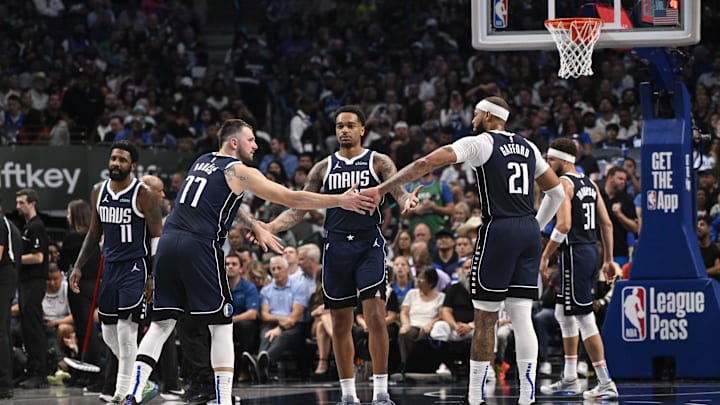 Oct 24, 2024; Dallas, Texas, USA; Dallas Mavericks guard Kyrie Irving (11) and guard Luka Doncic (77) and forward P.J. Washington (25) and center Daniel Gafford (21) and guard Klay Thompson (31) huddle up during the second half against the San Antonio Spurs at the American Airlines Center. Mandatory Credit: Jerome Miron-Imagn Images