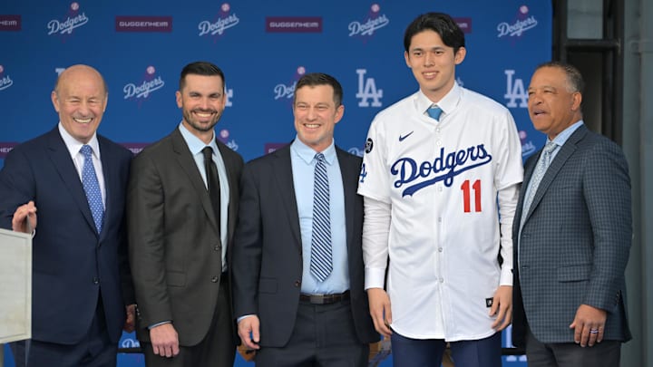 Jan 22, 2025; Los Angeles, CA, USA;  L-R; Los Angeles Dodgers President & CEO Stan Kasten, general manager Brandon Gomes, president of baseball operations Andrew Friedman, pitcher Roki Sasaki (11) and manager Dave Roberts during a press conference at Dodger Stadium. Mandatory Credit: Jayne Kamin-Oncea-Imagn Images  