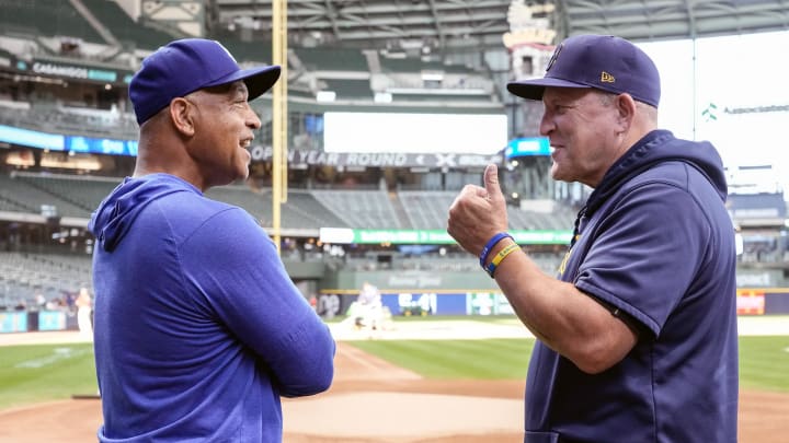 Aug 13, 2024; Milwaukee, Wisconsin, USA; Los Angeles Dodgers manager Dave Roberts (30) talks with Milwaukee Brewers manager Pat Murphy (21) prior to the game at American Family Field. Mandatory Credit: Jeff Hanisch-USA TODAY Sports Aug 13, 2024; Milwaukee, Wisconsin, USA; Los Angeles Dodgers manager Dave Roberts (30) talks with Milwaukee Brewers manager Pat Murphy (21) prior to the game at American Family Field. Mandatory Credit: Jeff Hanisch-USA TODAY Sports