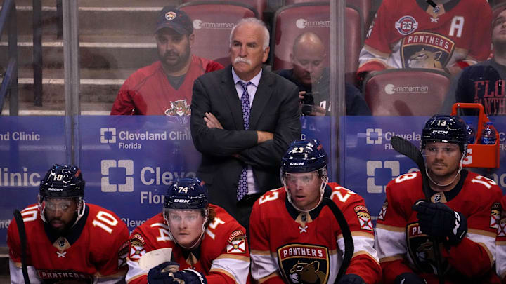 Oct 27, 2021; Sunrise, Florida, USA; Florida Panthers head coach Joel Quenneville stands behind the bench during the first period between the Florida Panthers and the Boston Bruins at FLA Live Arena. Mandatory Credit: Jasen Vinlove-Imagn Images