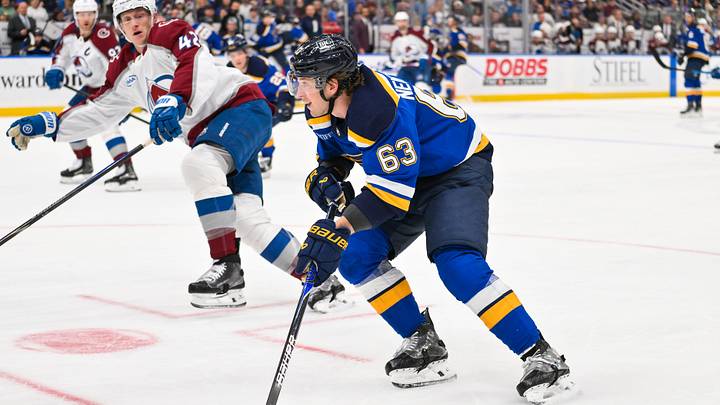 Apr 7, 2026; St. Louis, Missouri, USA; St. Louis Blues left wing Jake Neighbours (63) controls the puck against the Colorado Avalanche during the second period at Enterprise Center. Mandatory Credit: Jeff Curry-Imagn Images