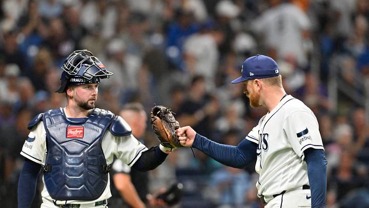 Oct 3, 2026; St. Petersburg, Florida, USA; Tampa Bay Rays catcher Liam Hicks (34) congratulates pitcher Drew Rasmussen (57) in the fifth inning in game one of the ALDS for the 2026 MLB Playoffs against the New York Yankees at Tropicana Field. Mandatory Credit: Pablo Robles-Imagn Images Oct 3, 2026; St. Petersburg, Florida, USA; Tampa Bay Rays catcher Liam Hicks (34) congratulates pitcher Drew Rasmussen (57) in the fifth inning in game one of the ALDS for the 2026 MLB Playoffs against the New York Yankees at Tropicana Field. Mandatory Credit: Pablo Robles-Imagn Images