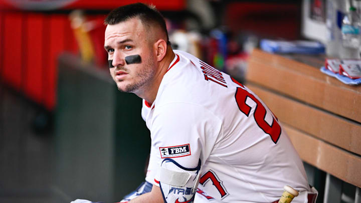 Aug 5, 2025; Anaheim, California, USA; Los Angeles Angels designated hitter Mike Trout (27) prepares to bat in the dugout during the first inning against the Tampa Bay Rays at Angel Stadium of Anaheim. Mandatory Credit: Kelvin Kuo-Imagn Images