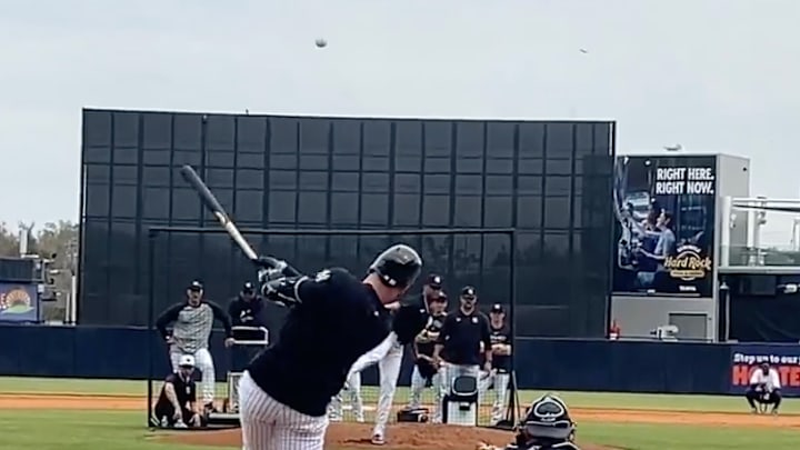 Judge making contact during a live batting practice session. 